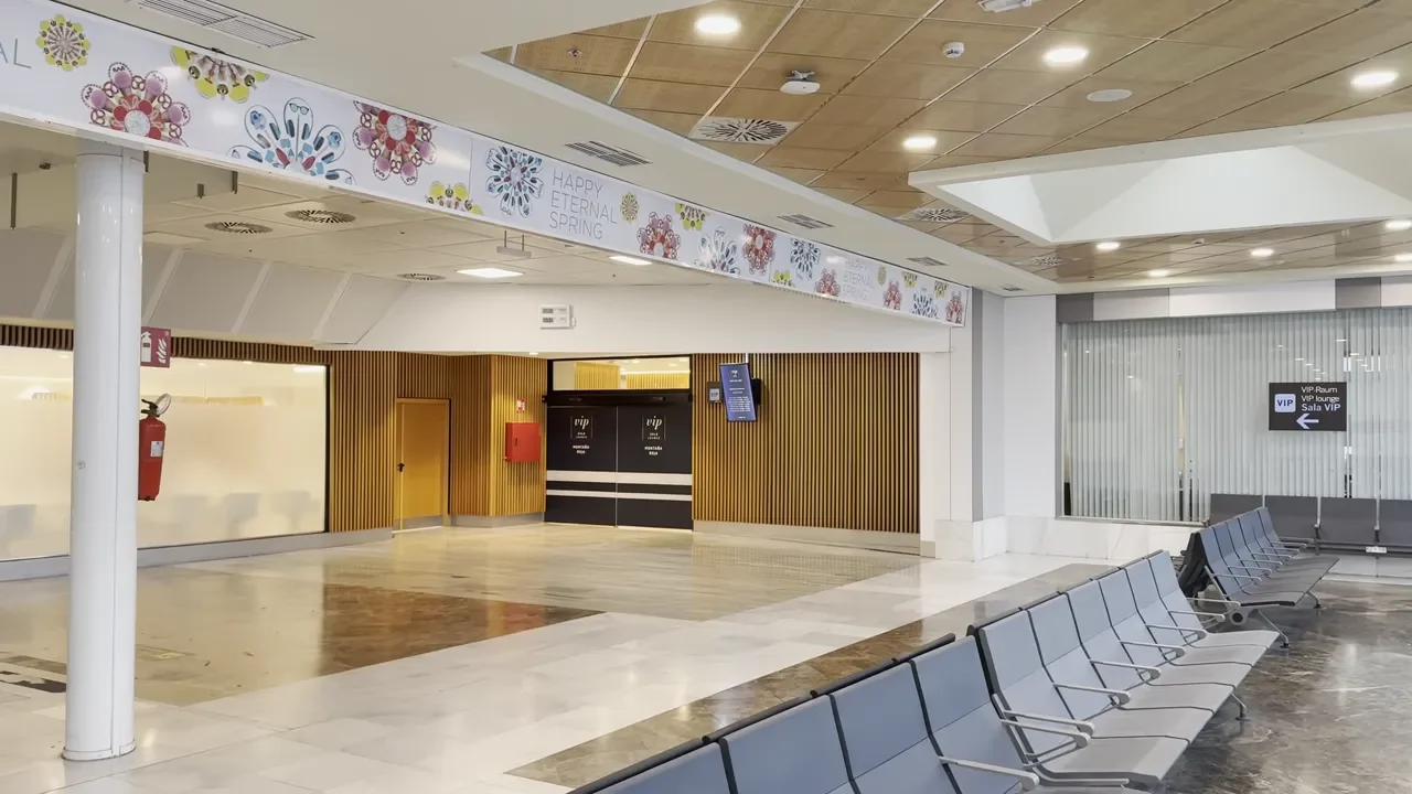 Entrance to Sala VIP lounge at Tenerife South Airport with signage and seating