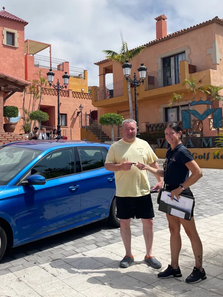 Sanasty hire car delivered and parked outside a hotel entrance in Playa de las Américas, Tenerife